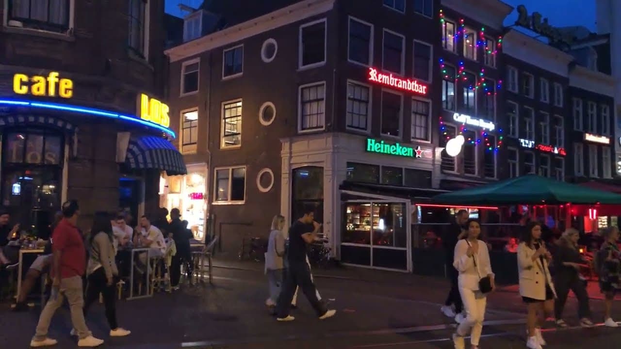 Bars and terraces lit up at night in central Amsterdam