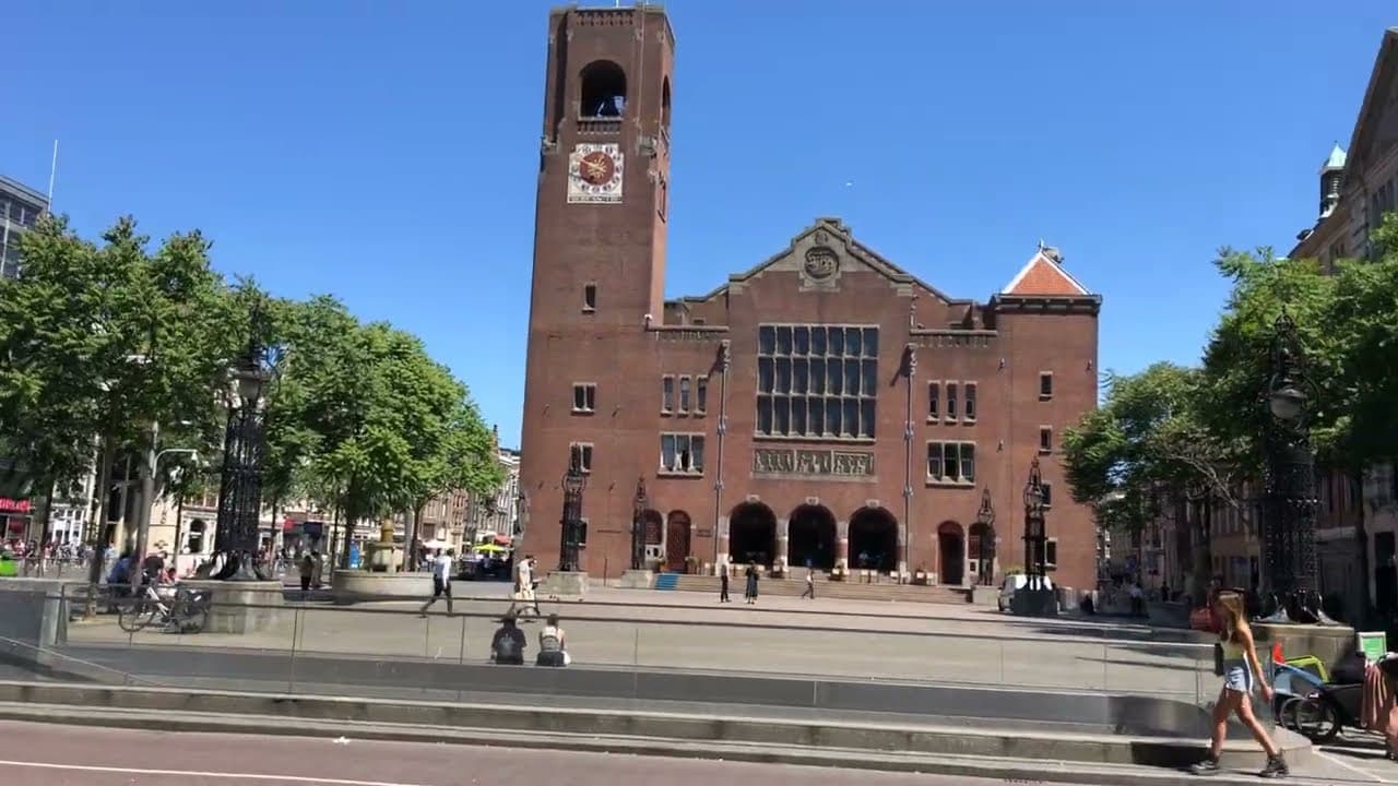 The Beurs van Berlage clock tower on a sunny day in central Amsterdam